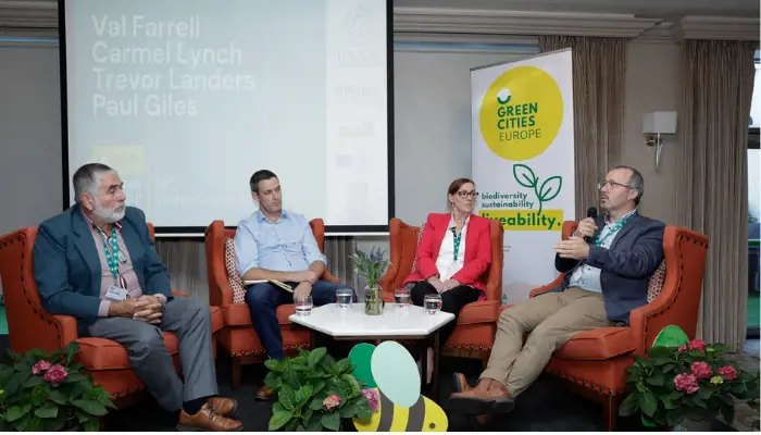 Four people sitting down and having a conversation at the Green Cities Europe seminar