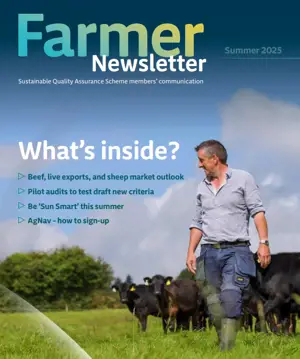 The cover of the Spring Farmer Newsletter Featuring a brown cow sitting in a rocky field